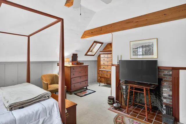 a bedroom with furniture and a window