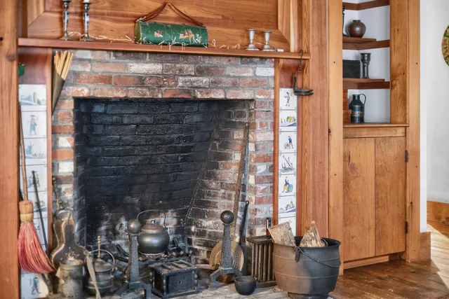 a front view of a house with sitting area