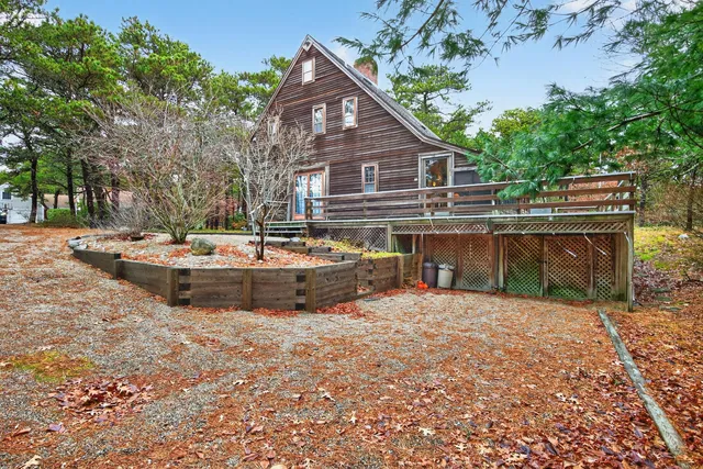 a view of a house with pool and sitting area