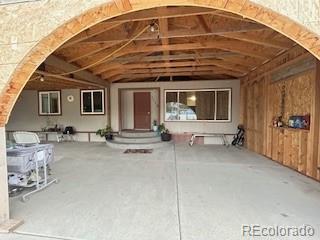 7115 Harold Street, Unit 2 Fort Lupton, CO 80621 - Photo 16 of 27 a front view of a house with basket ball court