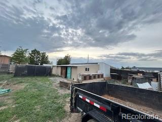 7115 Harold Street, Unit 2 Fort Lupton, CO 80621 - Photo 20 of 27 a terrace with outdoor seating and city view