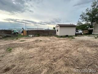 7115 Harold Street, Unit 2 Fort Lupton, CO 80621 - Photo 23 of 27 a view of backyard with barbeque and stove