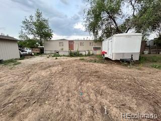 7115 Harold Street, Unit 2 Fort Lupton, CO 80621 - Photo 24 of 27 a view of a house with backyard
