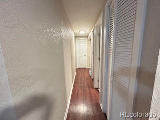 7115 Harold Street, Unit 2 Fort Lupton, CO 80621 - Photo 5 of 27 a view of hallway with wooden floor