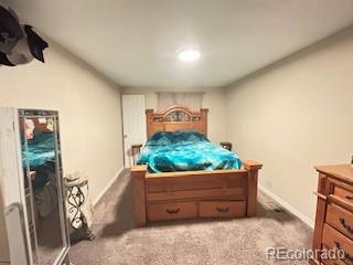 7115 Harold Street, Unit 2 Fort Lupton, CO 80621 - Photo 10 of 27 a view of a wooden door and bench in it