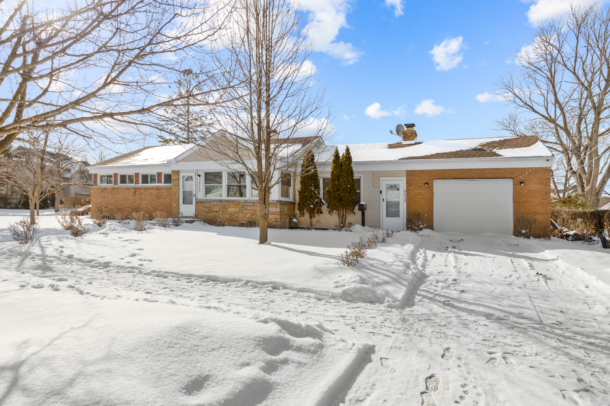 9432 Sayre Avenue Morton Grove, IL 60053 - Photo 20 of 20 a view of a large white house with a yard covered in snow