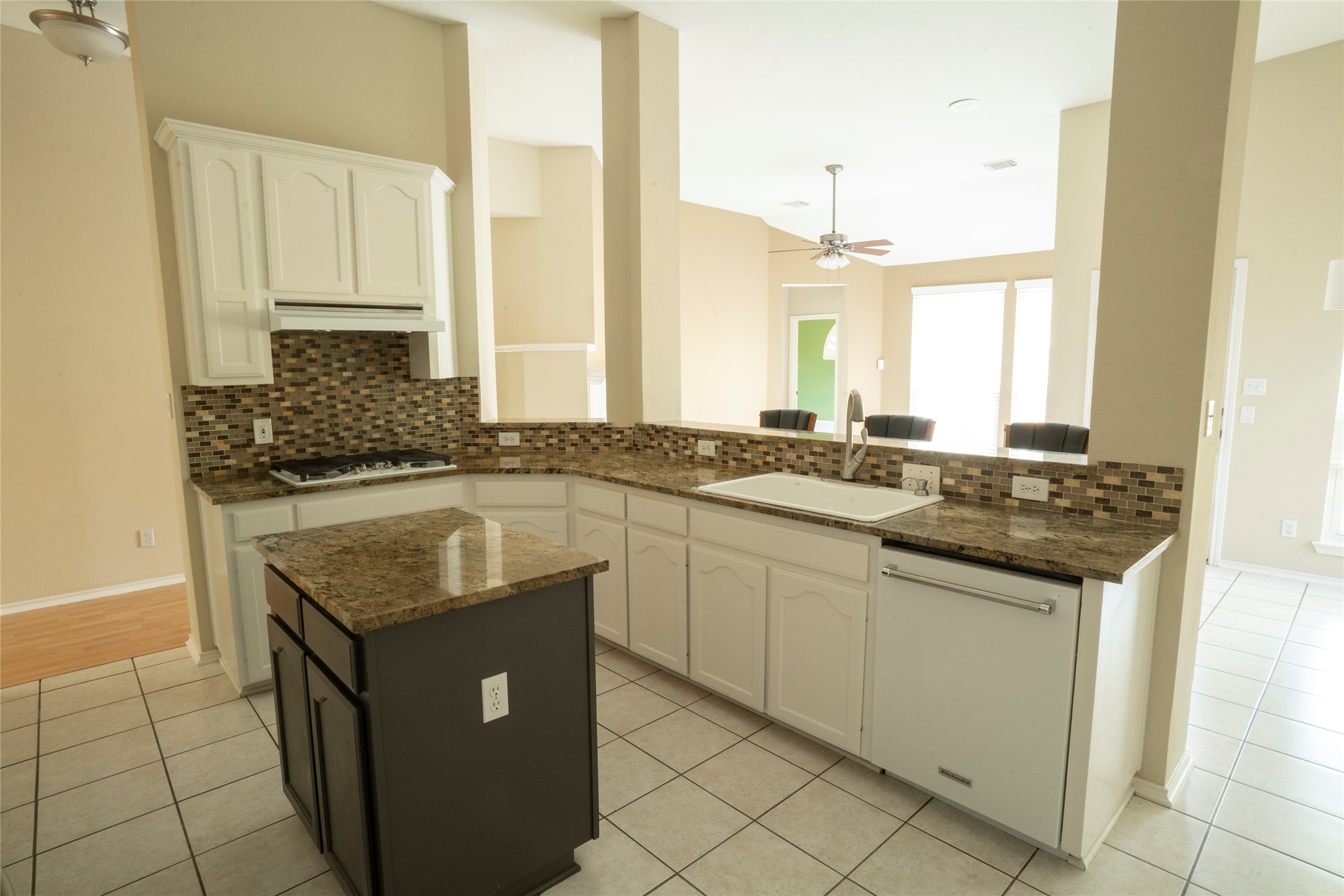 1712 Hackney Cove Austin, TX 78727 - Photo 12 of 38 a kitchen with granite countertop a sink and a stove