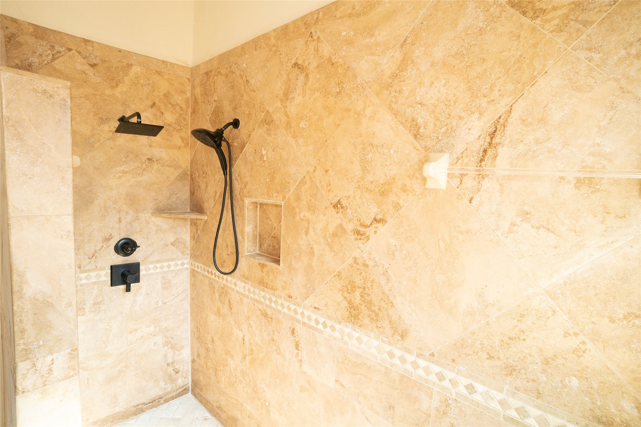 1712 Hackney Cove Austin, TX 78727 - Photo 18 of 38 Walk in primary shower with 2 shower heads and a bench