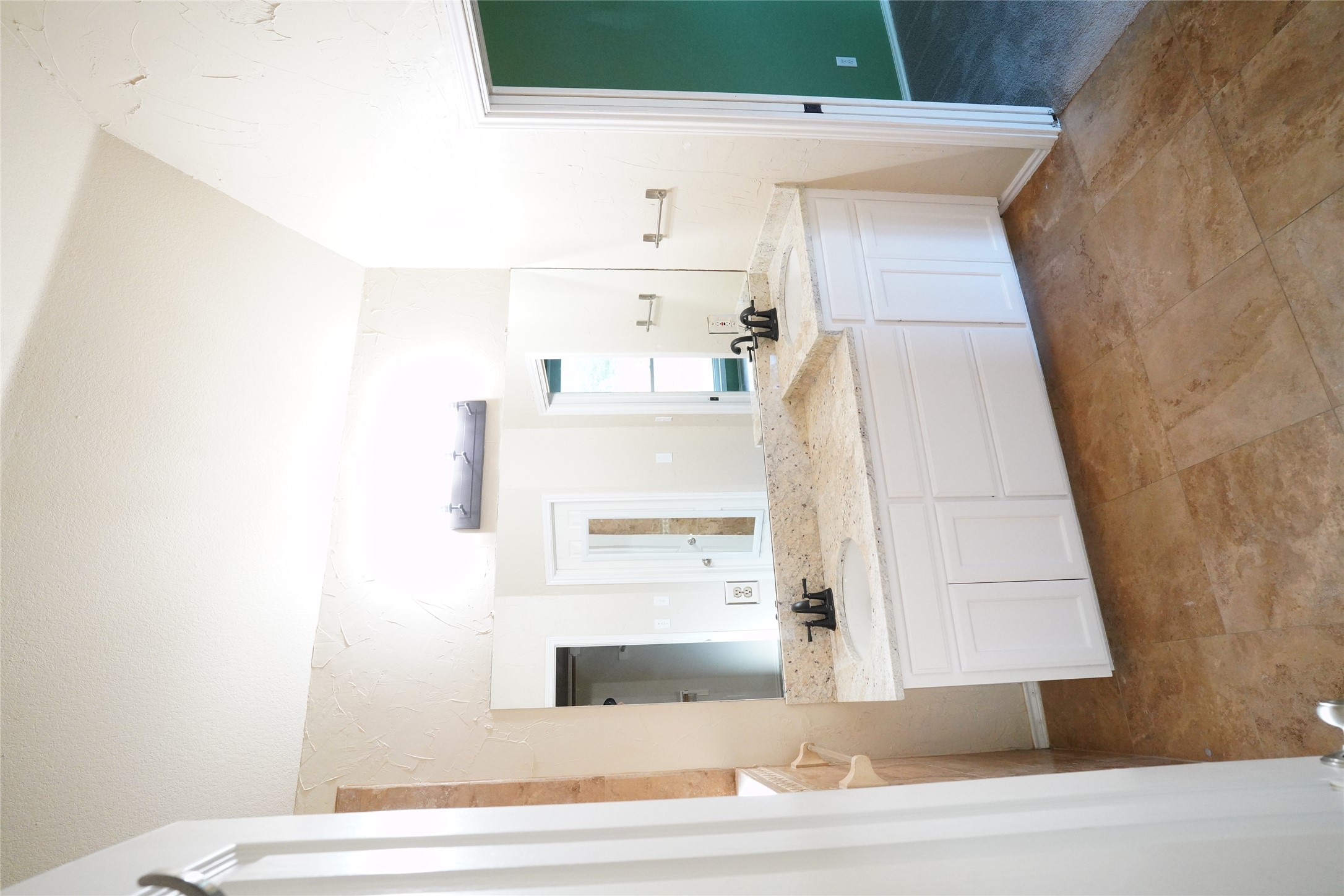 1712 Hackney Cove Austin, TX 78727 - Photo 19 of 38 a large bathroom with a double vanity sink mirror and a bathtub
