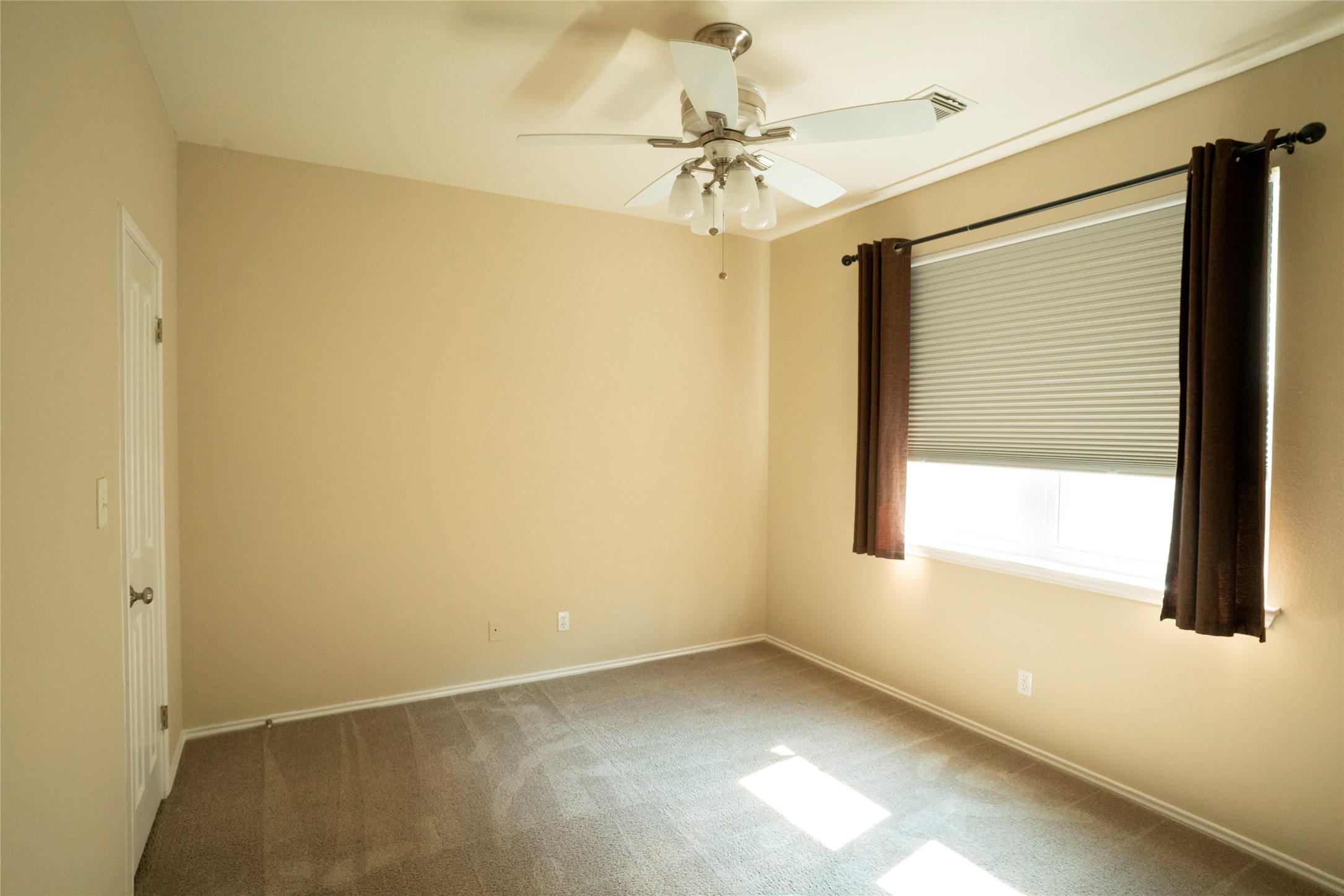 1712 Hackney Cove Austin, TX 78727 - Photo 22 of 38 One of the secondary bedrooms with a large window and walk in closet