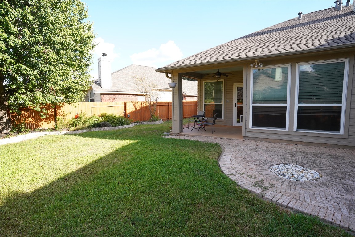 1712 Hackney Cove Austin, TX 78727 - Photo 30 of 38 a view of a house with backyard porch and garden