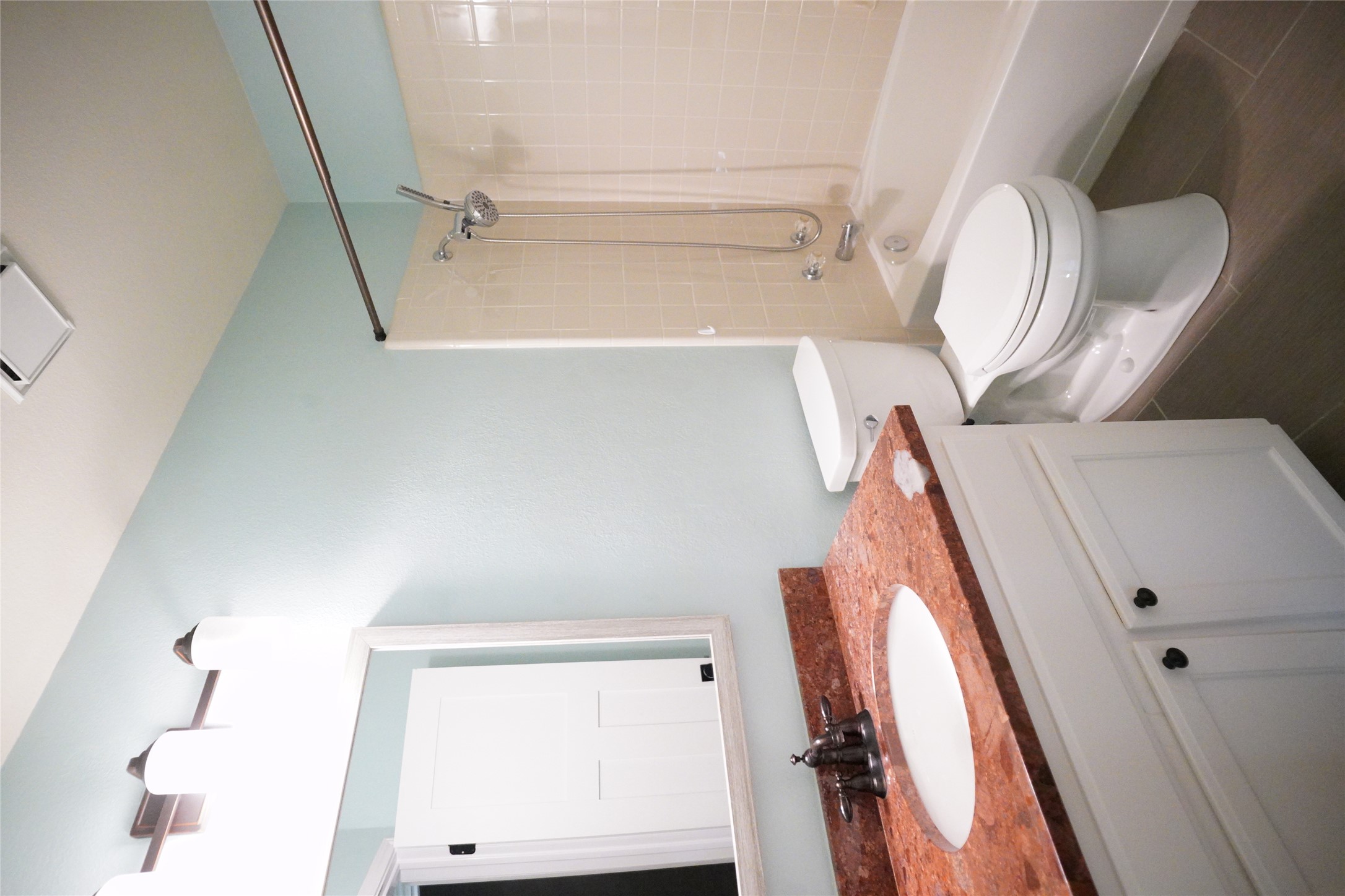 1712 Hackney Cove Austin, TX 78727 - Photo 38 of 38 a bathroom with a granite countertop sink toilet a mirror and shower