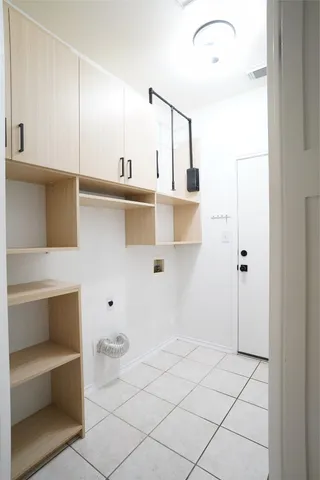 a living room with stainless steel appliances granite countertop furniture and a wooden floor