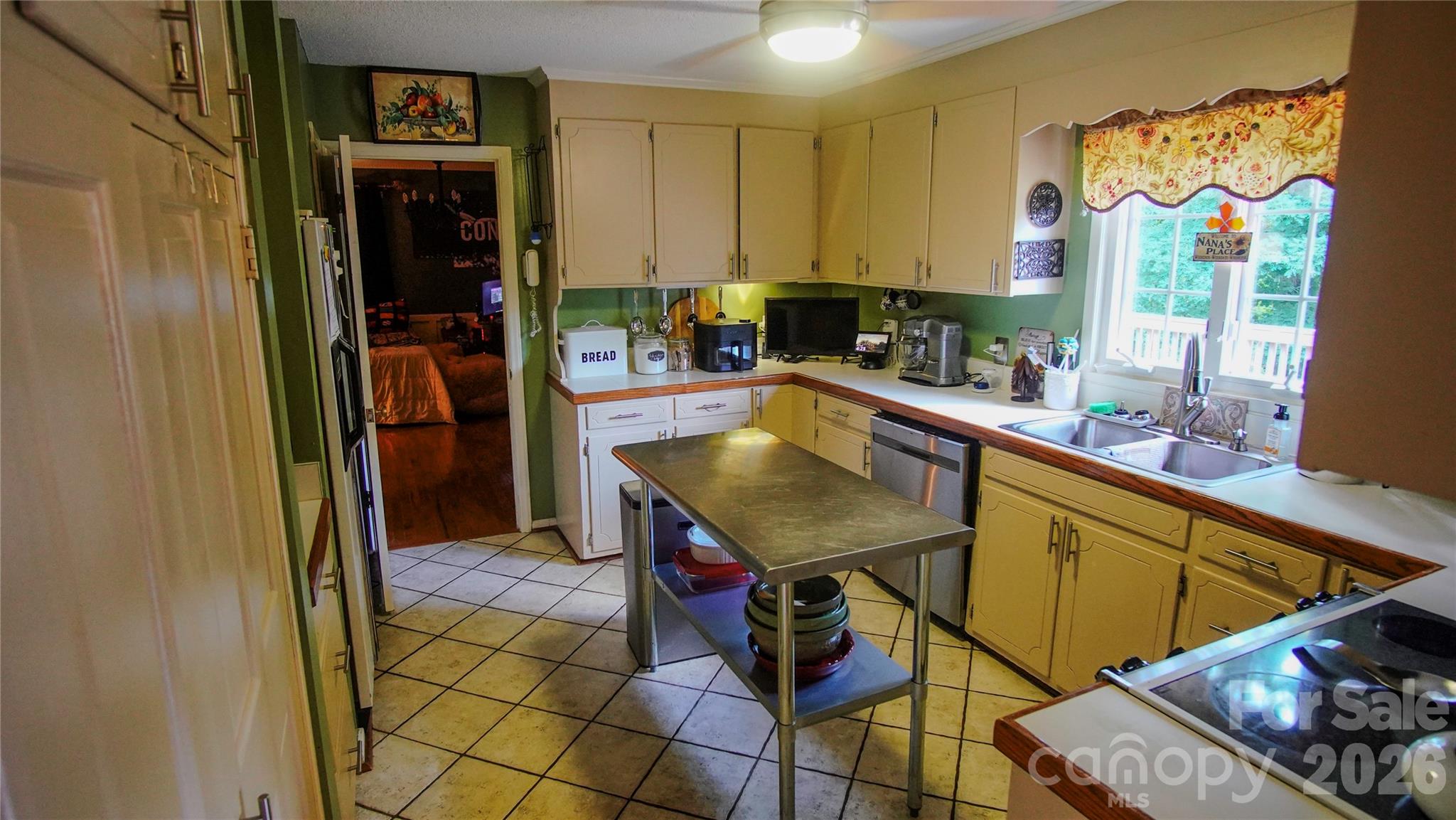 204 Old Stage Coach Road Lawndale, NC 28090 - Photo 15 of 30 a kitchen with stainless steel appliances granite countertop a sink and a refrigerator