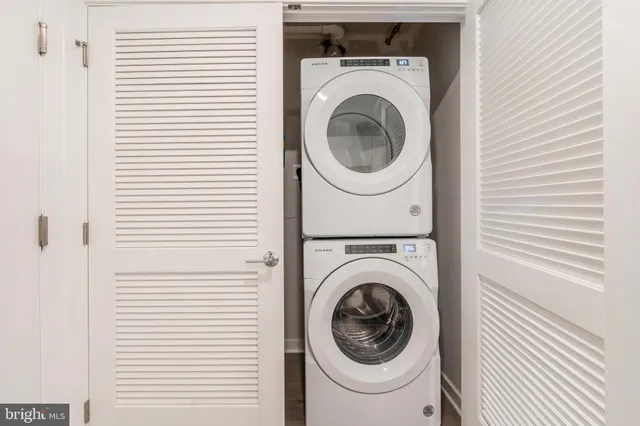 a view of a hallway with washer and dryer