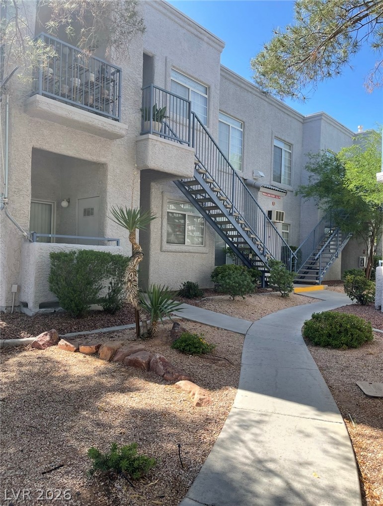 2201 Ramsgate Drive, Unit 915 Henderson, NV 89074 - Photo 3 of 36 A well-maintained stucco exterior features multiple balconies and functional exterior staircases.