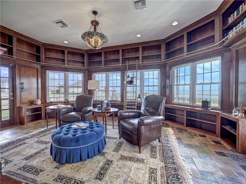 334 Pebble Beach Drive Portland, TX 78374 - Photo 20 of 40 a living room with furniture a chandelier and a large window