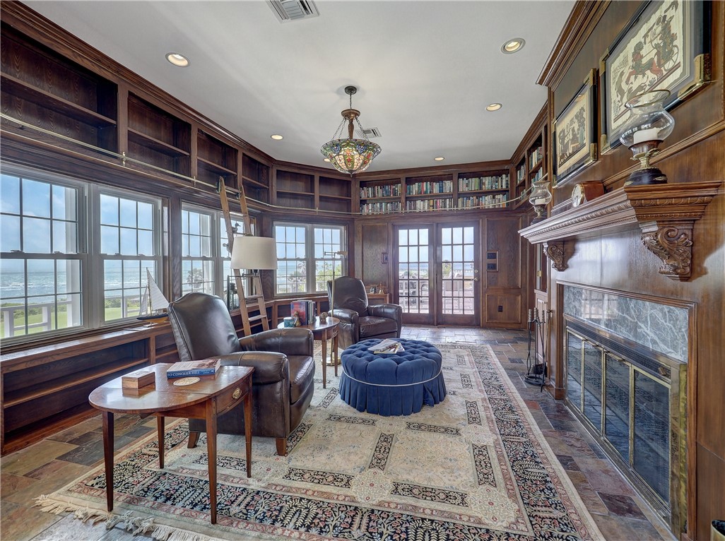 334 Pebble Beach Drive Portland, TX 78374 - Photo 21 of 40 a living room with furniture a fireplace and a chandelier