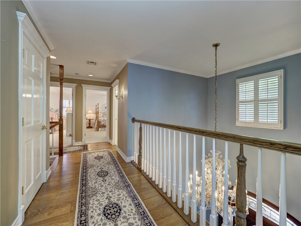 334 Pebble Beach Drive Portland, TX 78374 - Photo 29 of 40 a view of a hallway with wooden floor and staircase
