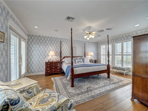 a bedroom with furniture and a chandelier