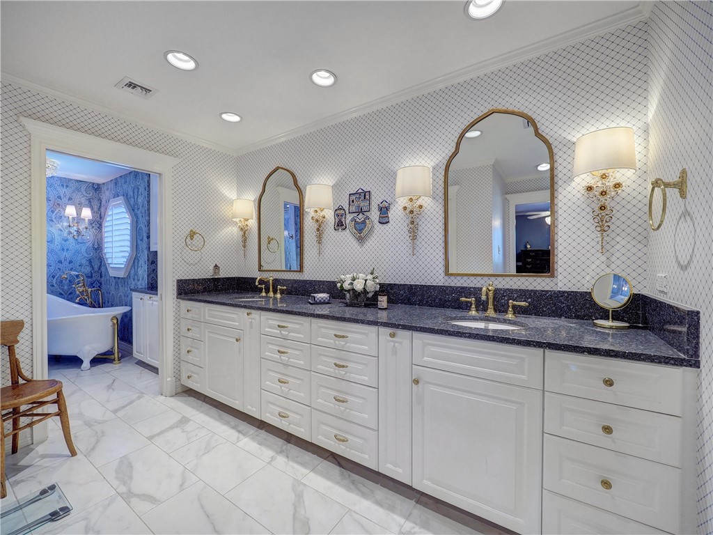 334 Pebble Beach Drive Portland, TX 78374 - Photo 32 of 40 a bathroom with double vanity sinks and a mirror