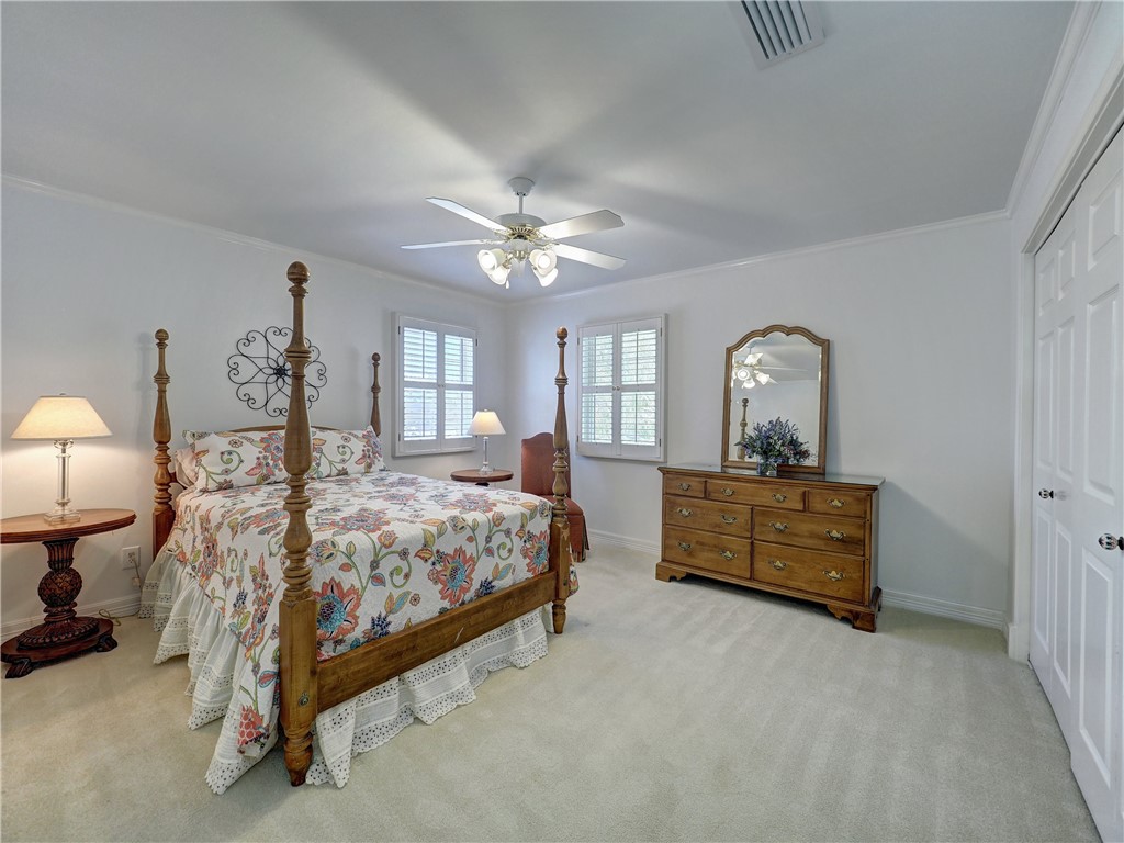 334 Pebble Beach Drive Portland, TX 78374 - Photo 37 of 40 a bed room with a bed and a mirror