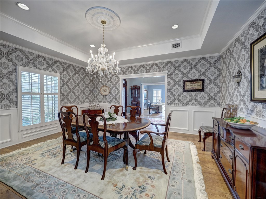 334 Pebble Beach Drive Portland, TX 78374 - Photo 8 of 40 a view of a dining room with furniture and chandelier