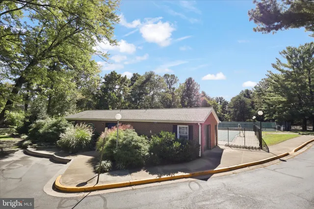 a view of a house with swimming pool and sitting area