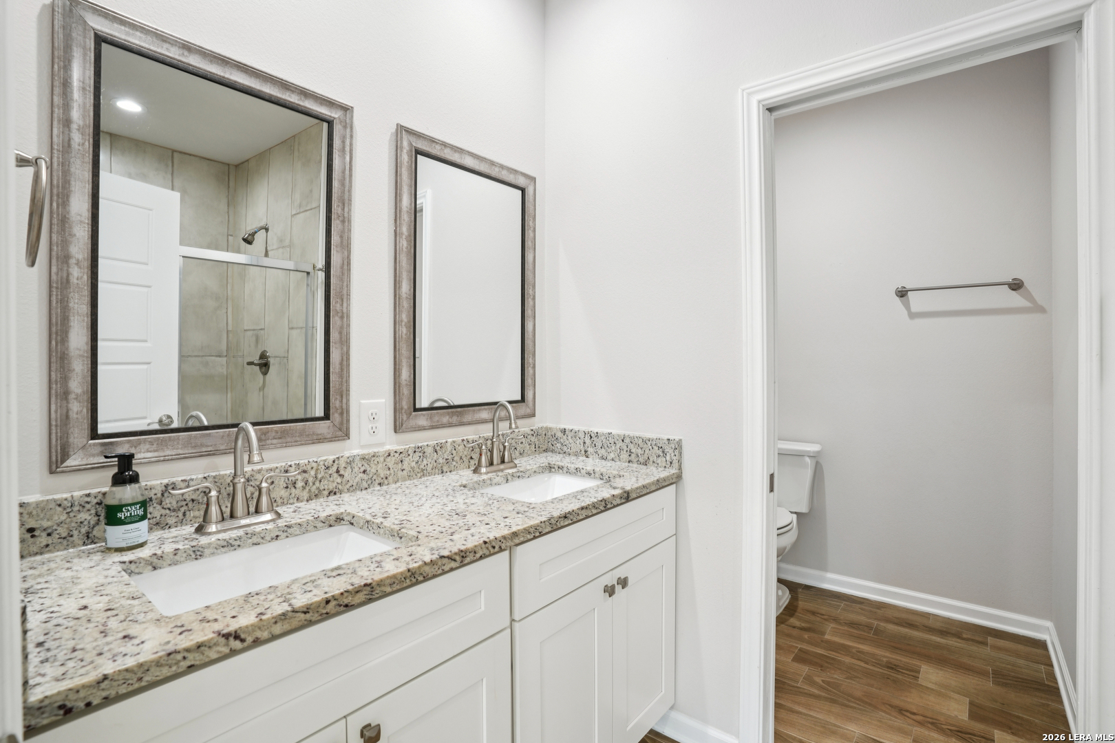 156 Remington Road Spring Branch, TX 78070 - Photo 16 of 32 a bathroom with a granite countertop sink and a mirror