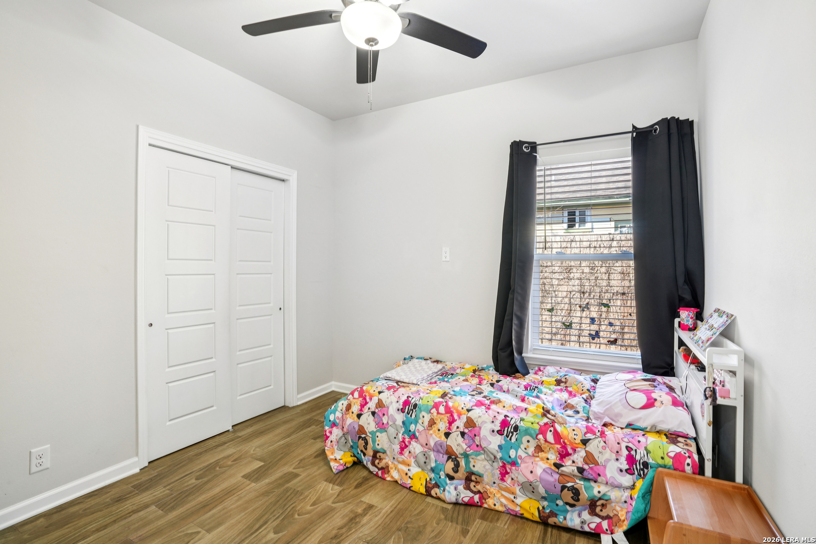 156 Remington Road Spring Branch, TX 78070 - Photo 19 of 32 a bedroom with a bed and a window