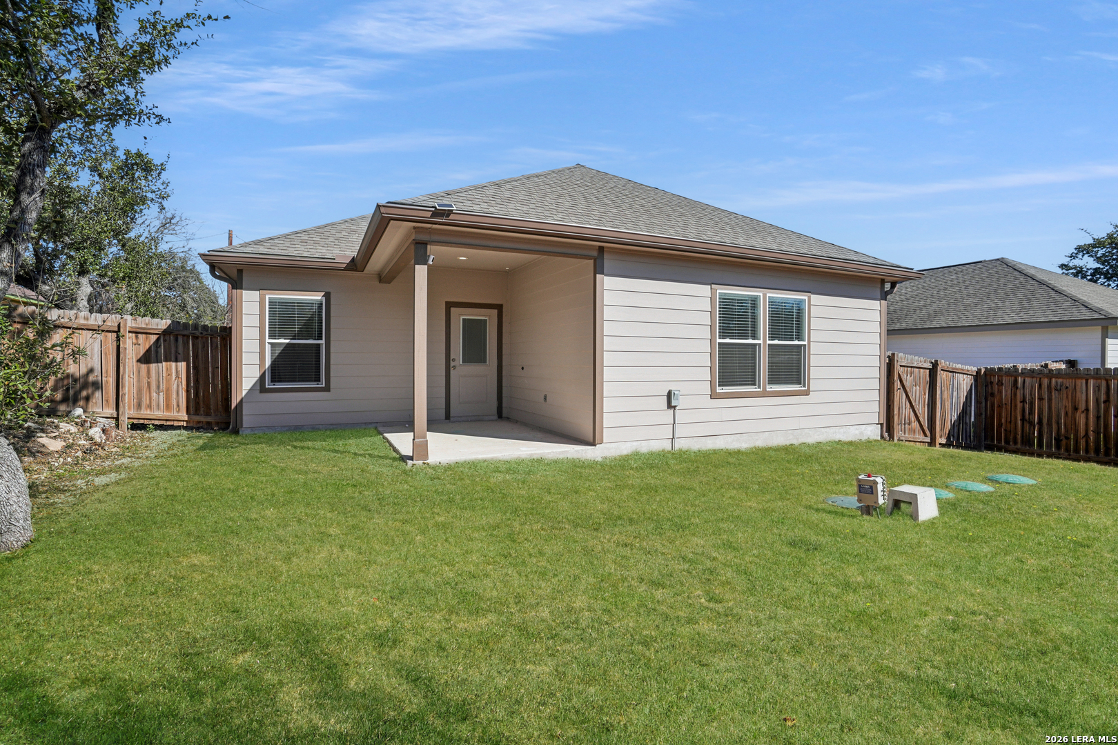 156 Remington Road Spring Branch, TX 78070 - Photo 26 of 32 a front view of a house with a yard