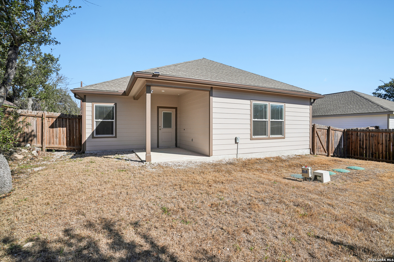 156 Remington Road Spring Branch, TX 78070 - Photo 28 of 32 a front view of a house with a yard