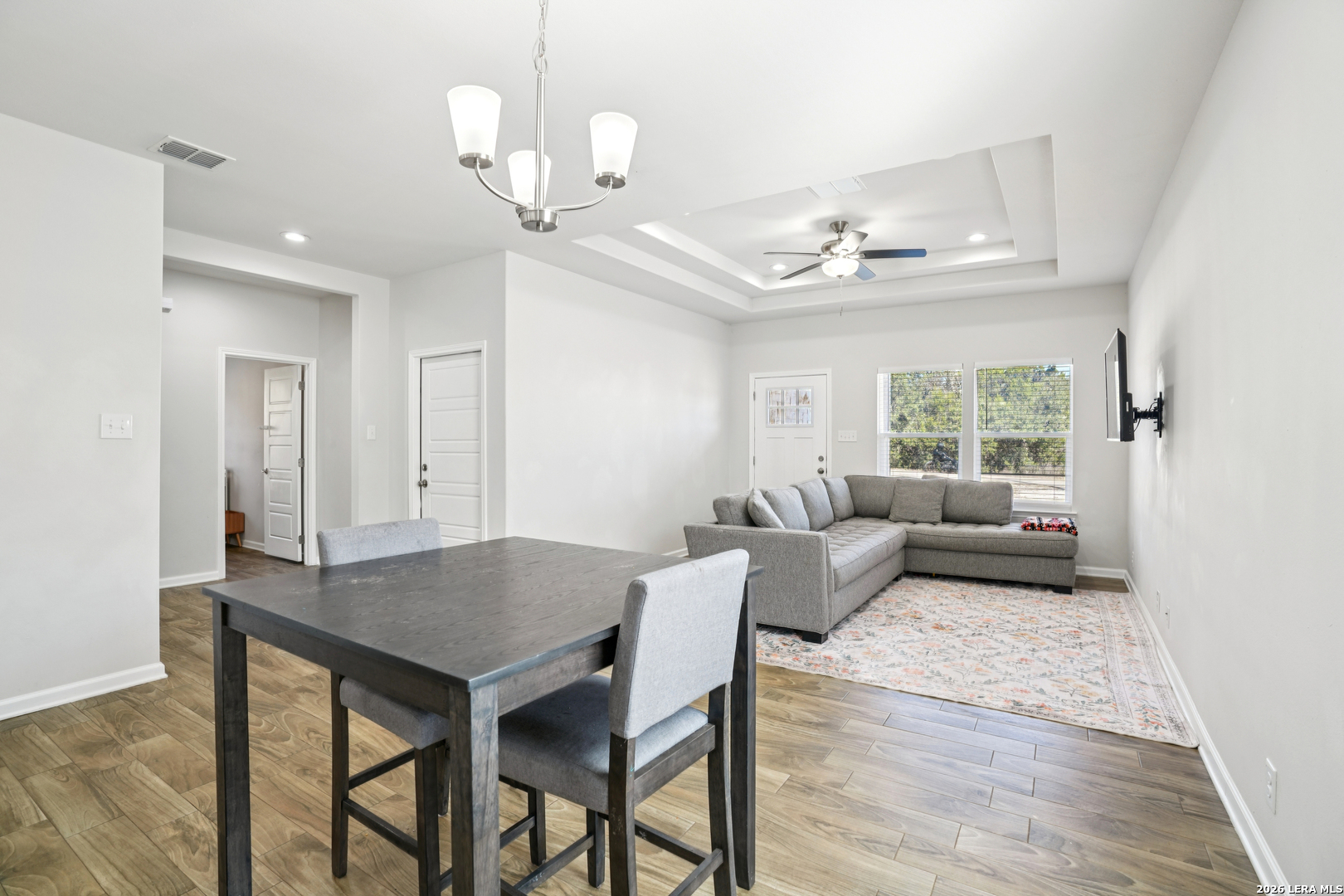 156 Remington Road Spring Branch, TX 78070 - Photo 8 of 32 a view of a dining room with furniture window and wooden floor