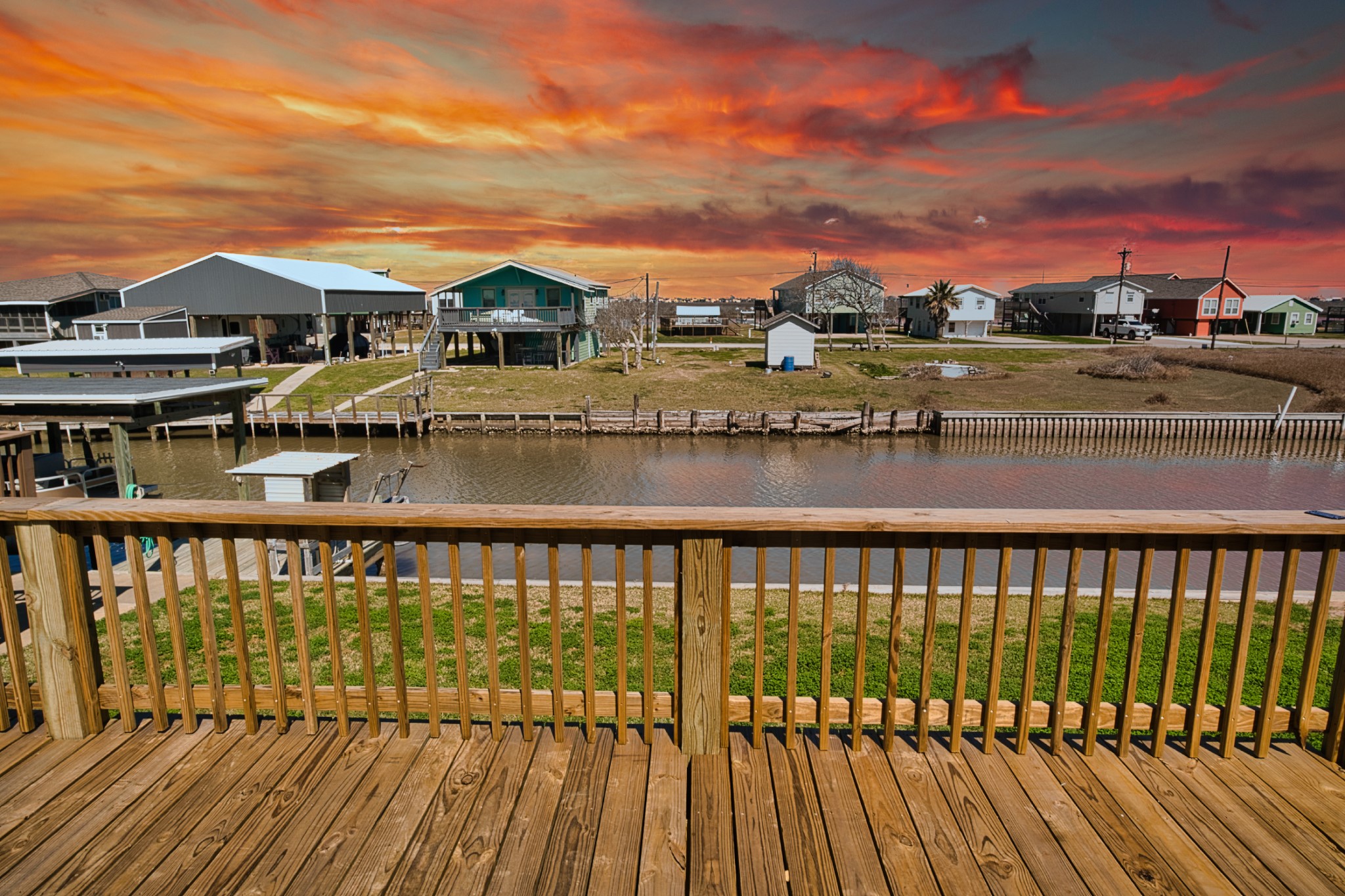 976 County Road 201 Sargent, TX 77414 - Photo 1 of 40 AI-generated view of sunset over the canal