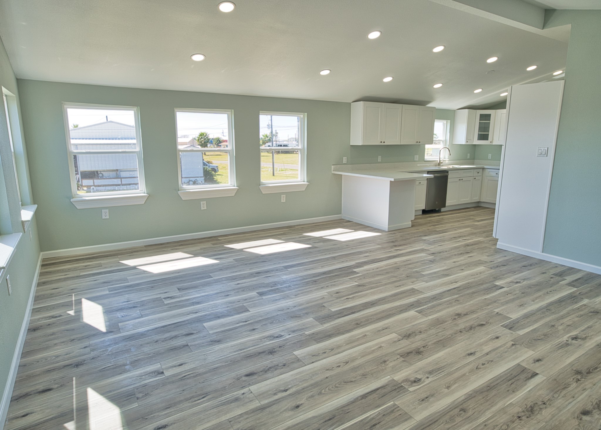 976 County Road 201 Sargent, TX 77414 - Photo 7 of 40 Stepping in the door looking across the huge living room toward the kitchen