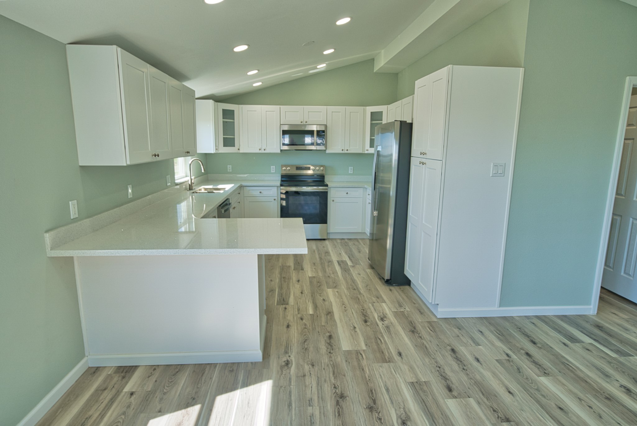976 County Road 201 Sargent, TX 77414 - Photo 8 of 40 Large kitchen with a breakfast bar to save space but have a dedicated eating area