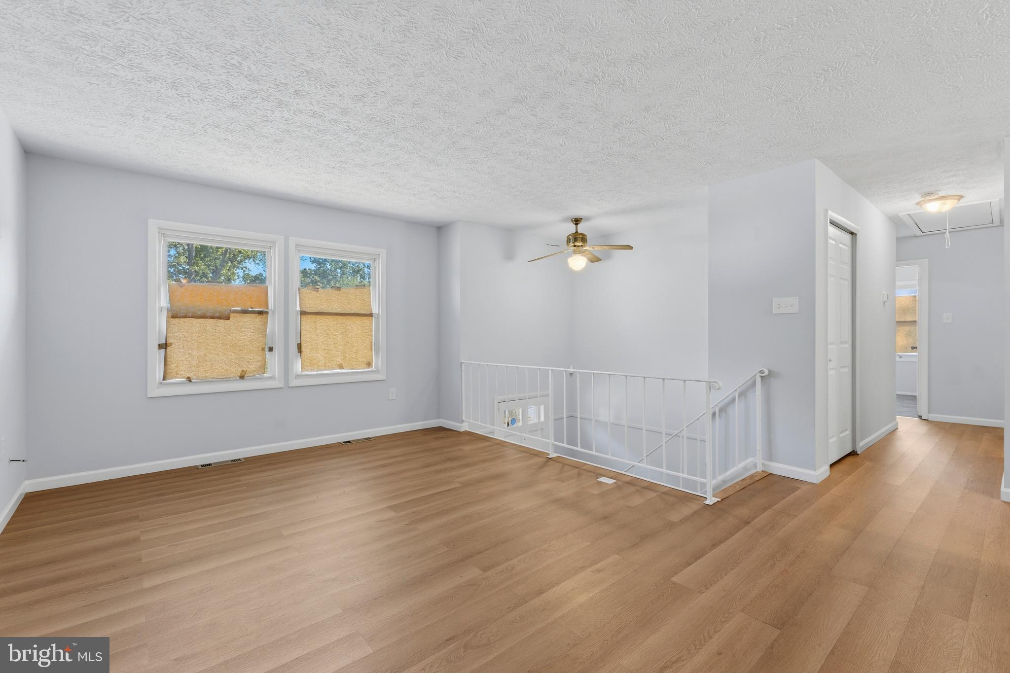 119 Jefferson Road Waldorf, MD 20602 - Photo 11 of 40 an empty room with wooden floor and windows