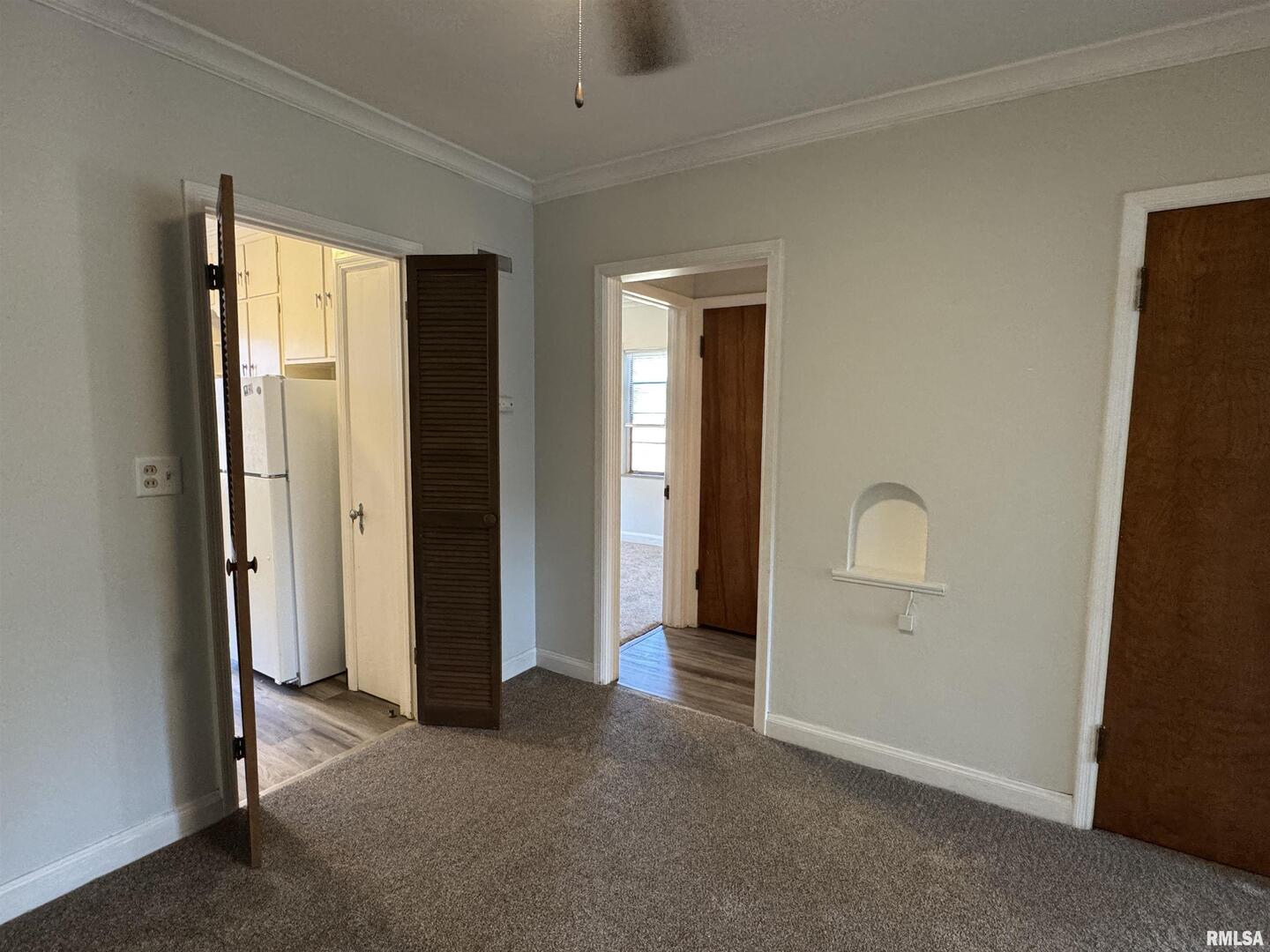405 West Columbia Avenue, Unit 6 undefined, IA 52803 - Photo 6 of 12 an empty room with windows