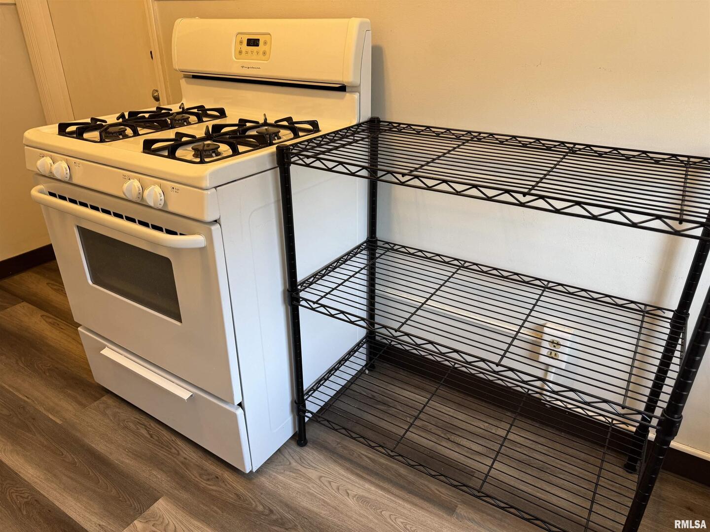 405 West Columbia Avenue, Unit 6 undefined, IA 52803 - Photo 9 of 12 a kitchen with a stove and a microwave