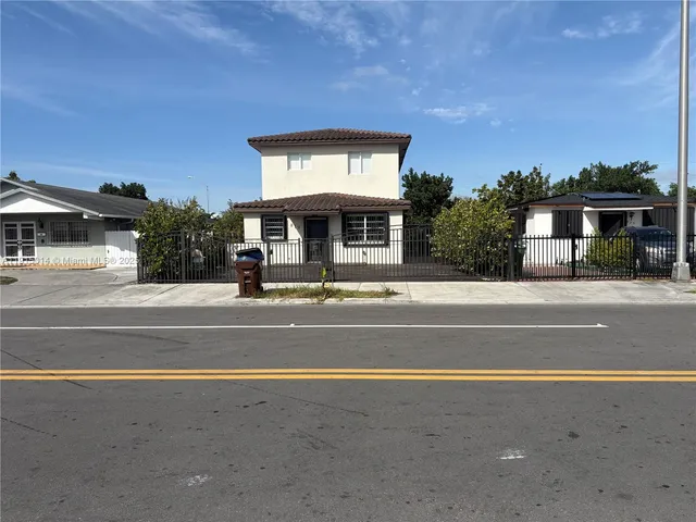 a view of a house with a swimming pool