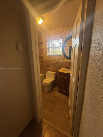 a view of an empty room with windows