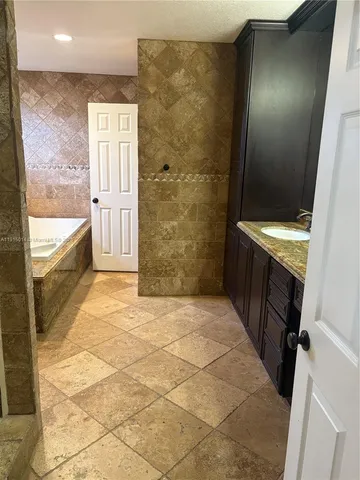 a bathroom with a double vanity sink and mirror