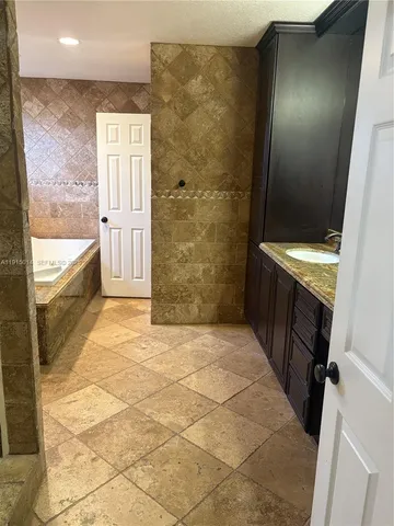 a bathroom with a double vanity sink and mirror