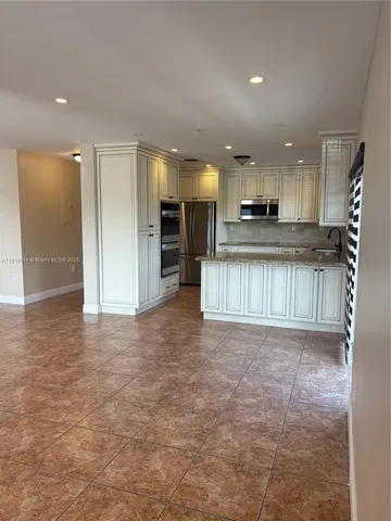 an empty room with a fireplace