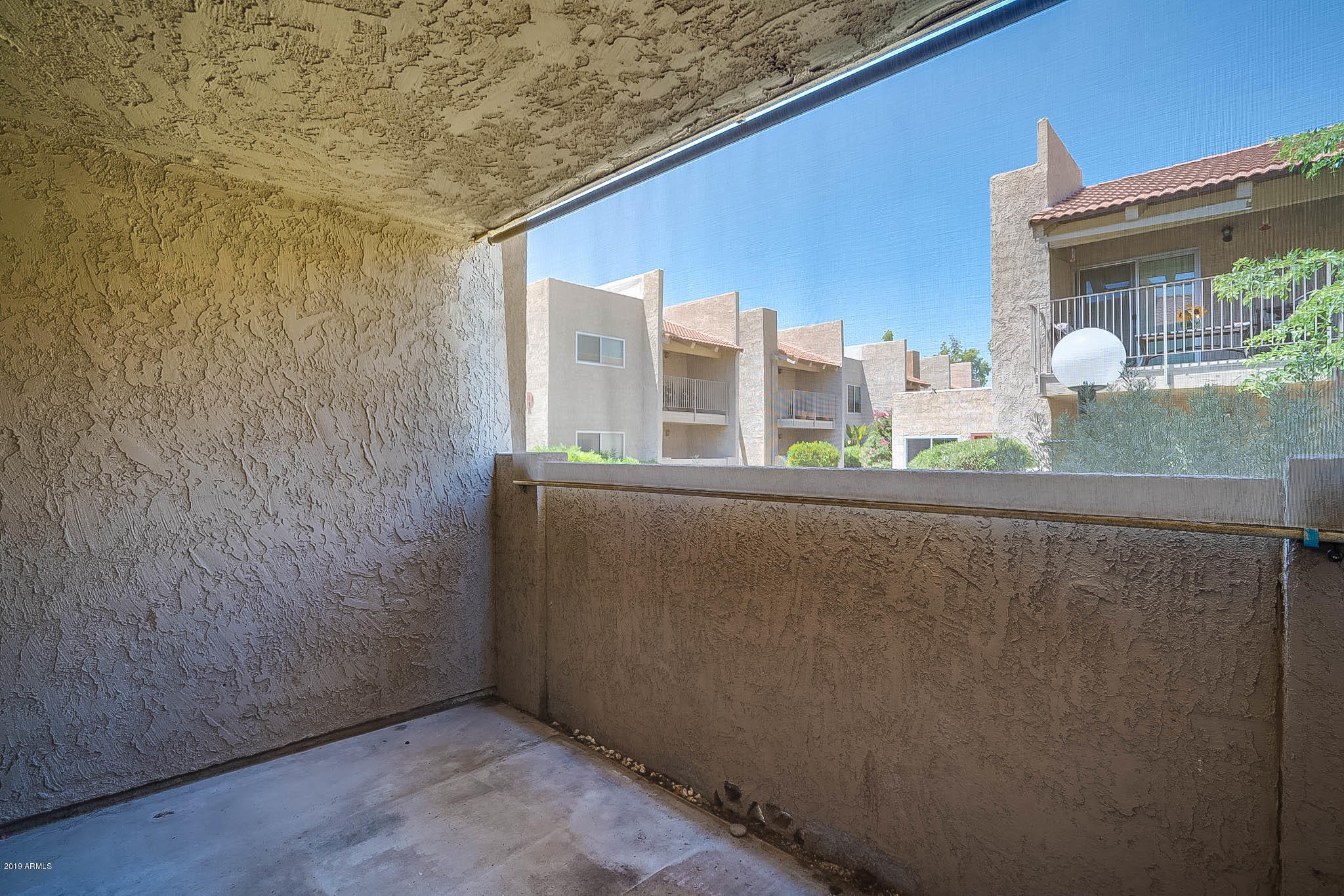 5525 East Thomas Road, Unit R12 Phoenix, AZ 85018 - Photo 5 of 14 a view of balcony with small yard