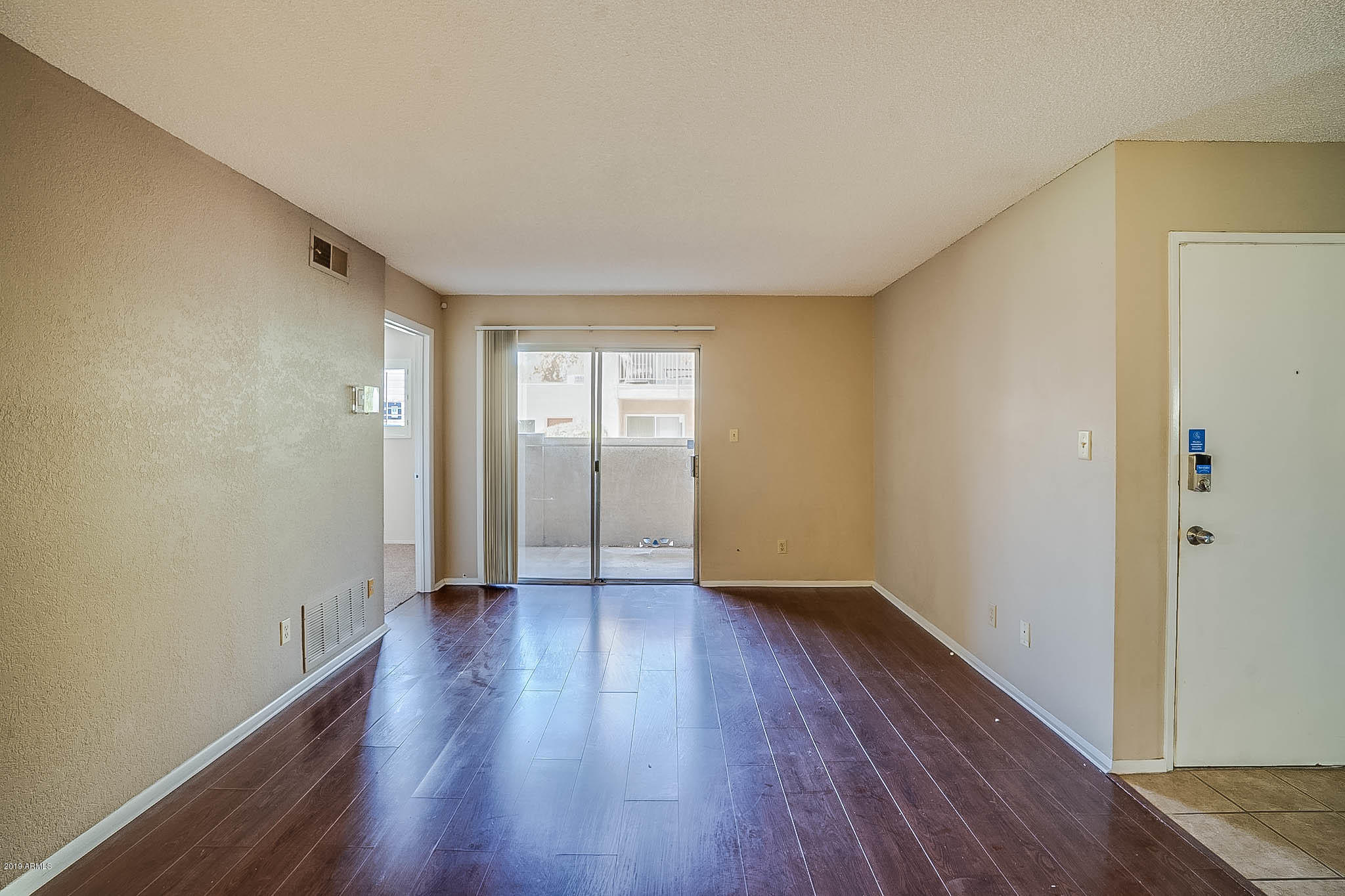 5525 East Thomas Road, Unit R12 Phoenix, AZ 85018 - Photo 6 of 14 wooden floor in an empty room