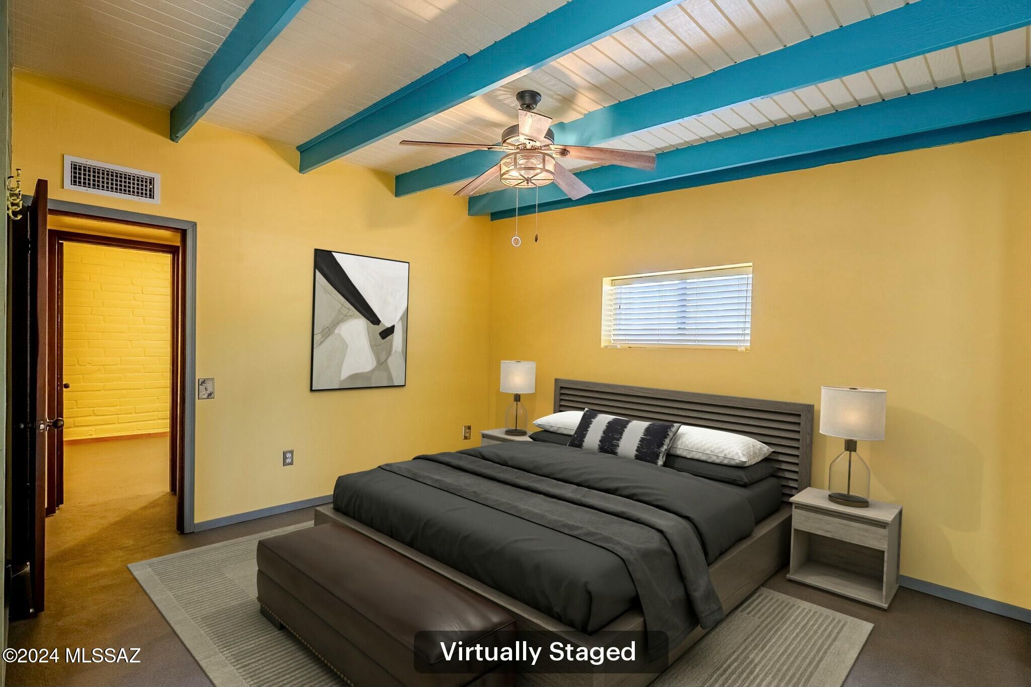 1312 Avenida Gutierrez Rio Rico, AZ 85648 - Photo 16 of 46 a bedroom with a bed and wooden floor