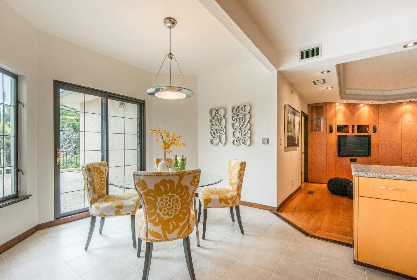 760 Darrell Road Hillsborough, CA 94010 - Photo 11 of 35 a dining room with furniture and a chandelier