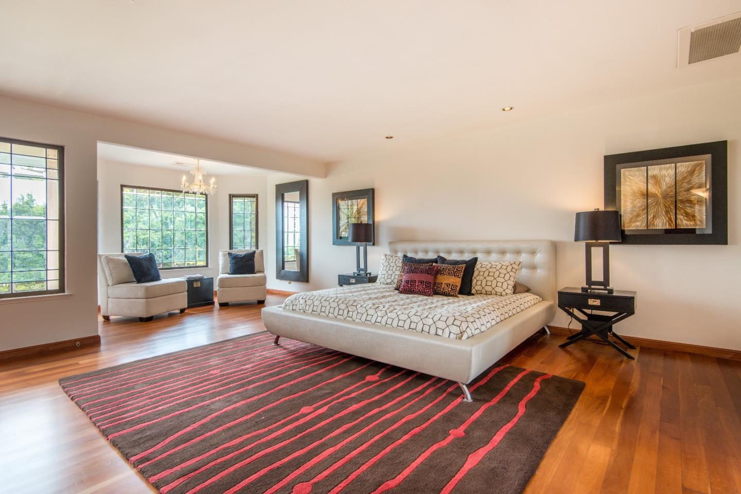 760 Darrell Road Hillsborough, CA 94010 - Photo 17 of 35 a bedroom with a bed and glass window