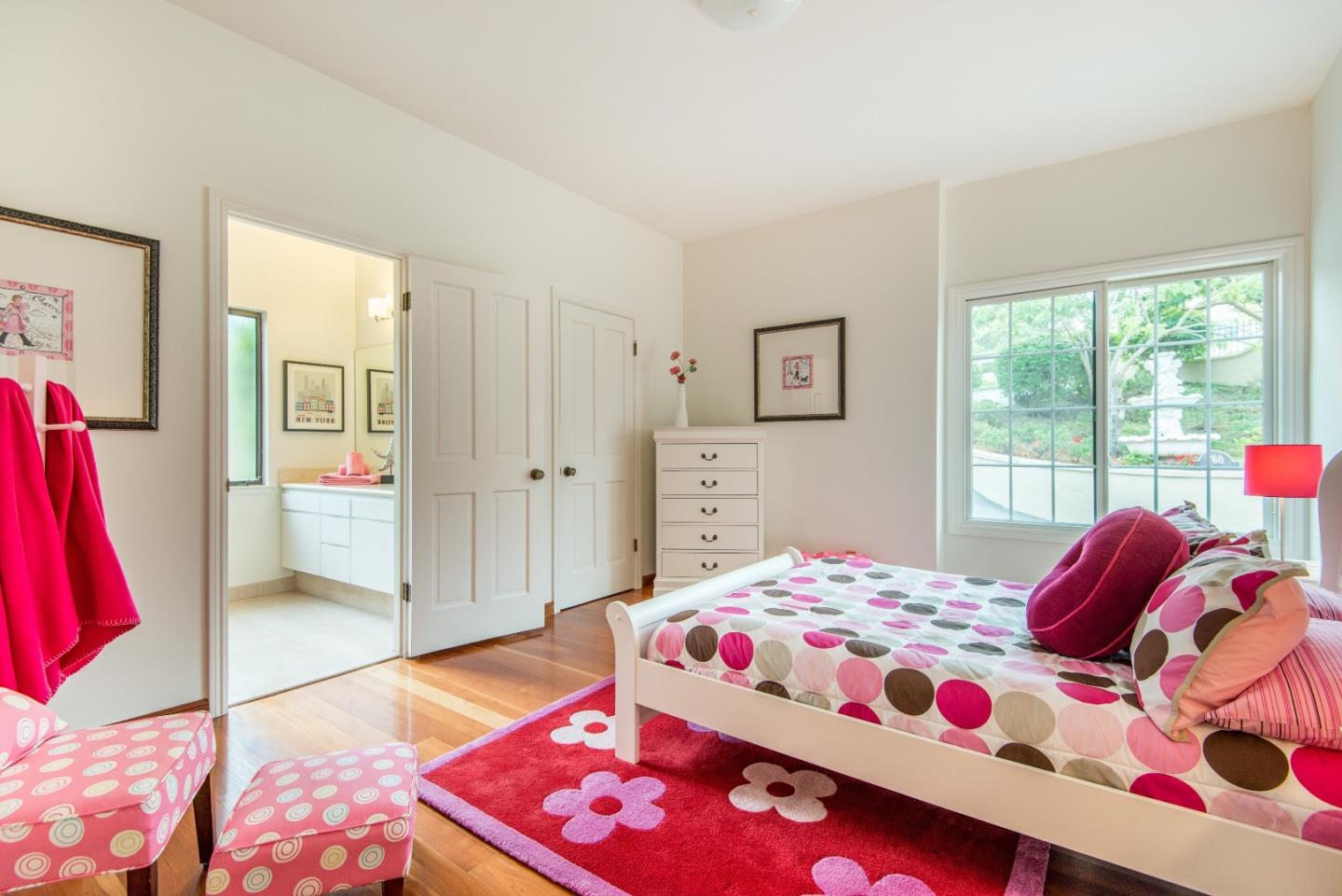 760 Darrell Road Hillsborough, CA 94010 - Photo 23 of 35 a bedroom with a bed and a potted plant